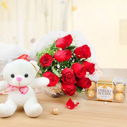 12 Roses with a cute 6" Teddy and 16 Ferrero Rochers